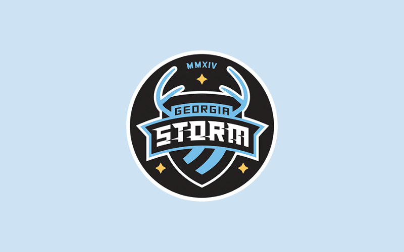 Georgia Storm FC Crest Georgia Storm FC circular crest with antlers and stars on a light blue background.