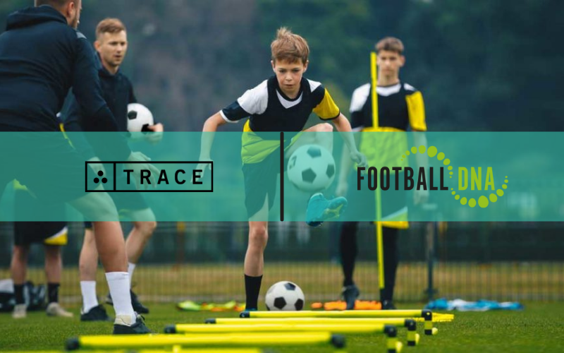 Trace and Football DNA partnership graphic over boys doing cone and pole dribbling drills