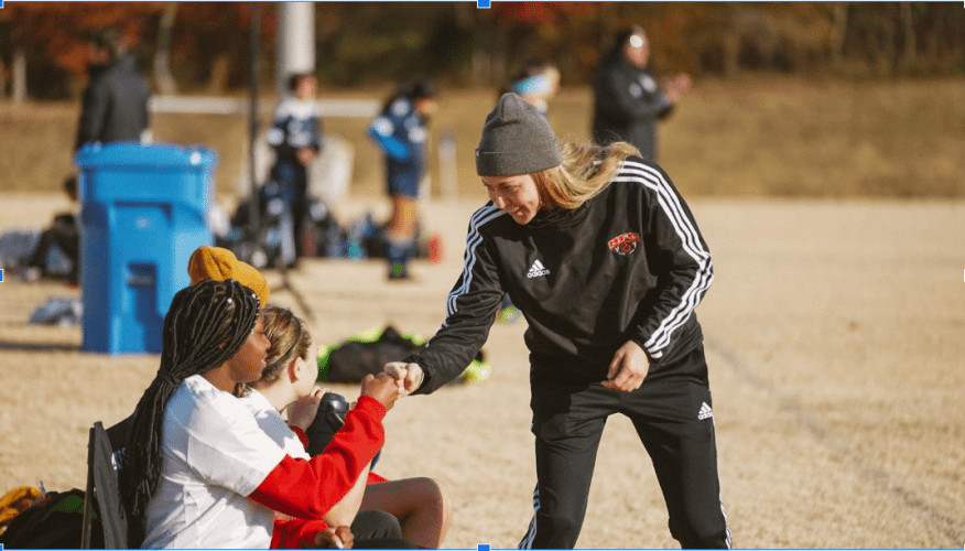 Coach giving positive feedback and encouragement