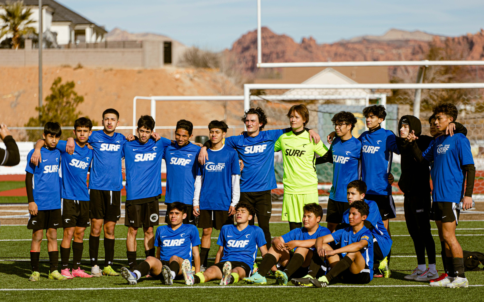 Soccer Team Group Photo Boys soccer team in blue Surf kits posing together for a group photo on the field