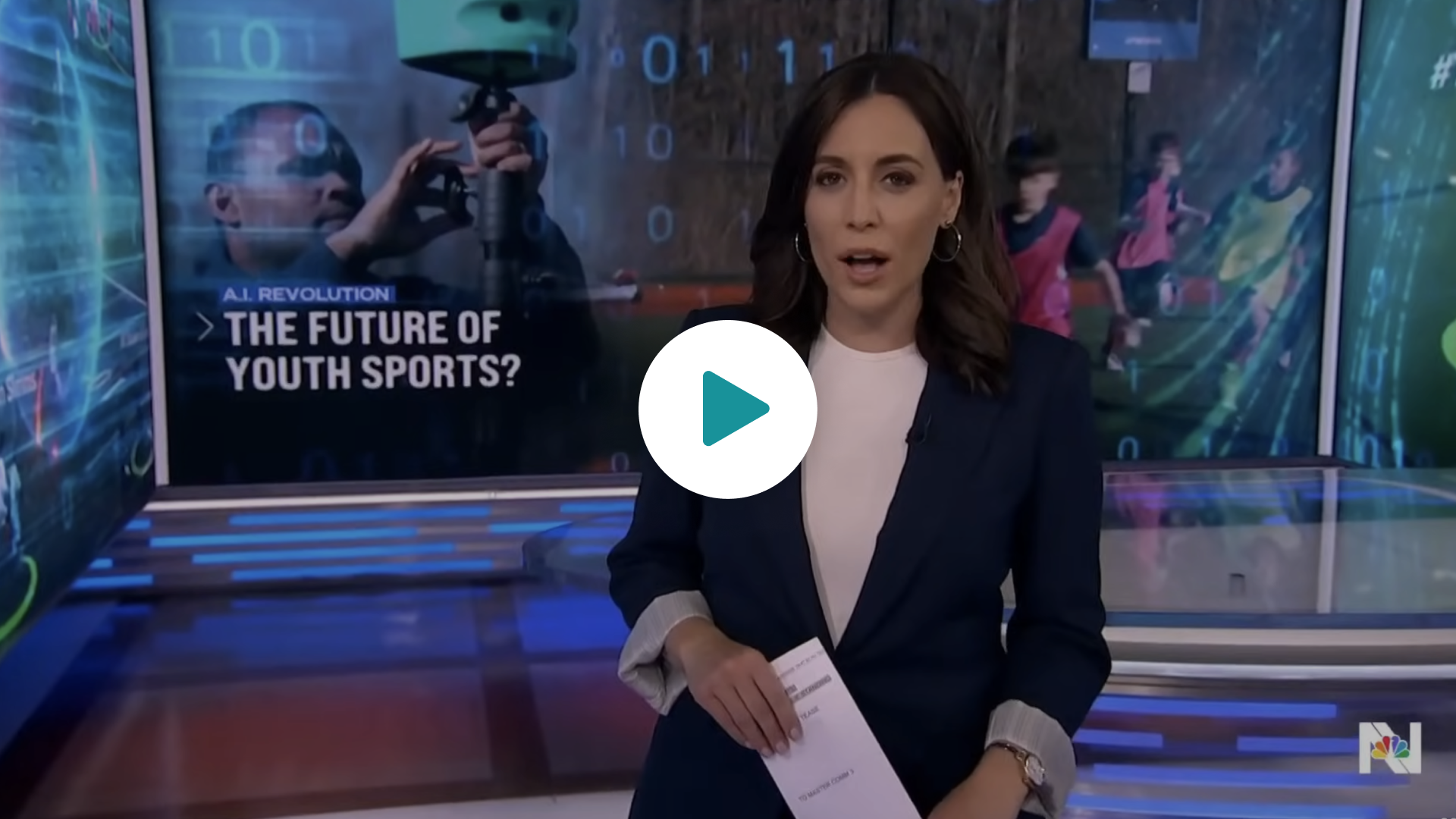 NBC news anchor in studio before a screen reading The Future of Youth Sports, with a play button overlay.
